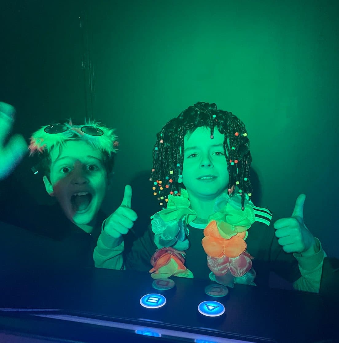 Two delighted children in fancy dress during a Défi Quiz