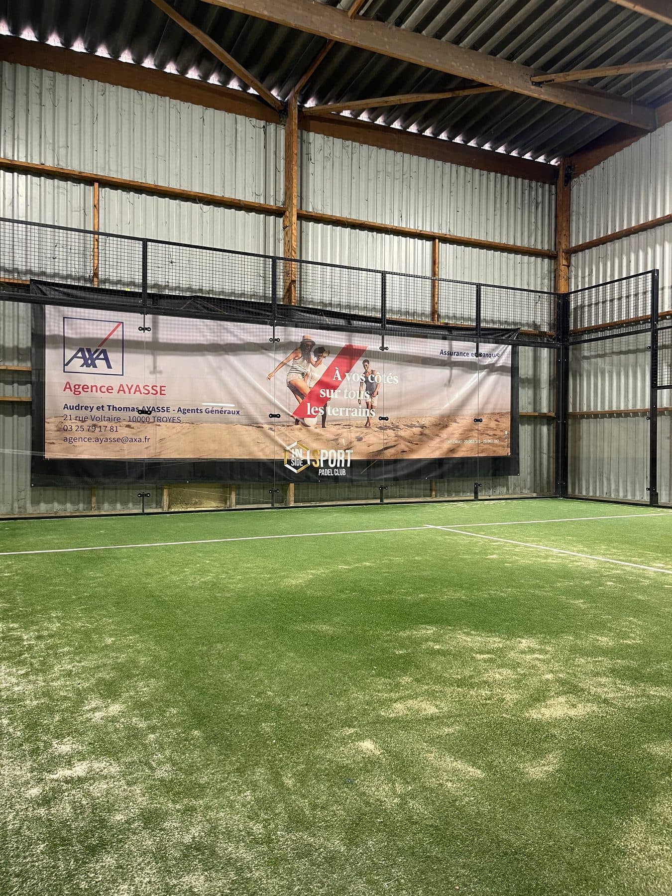 Company advertising banner installed at the back of a pitch